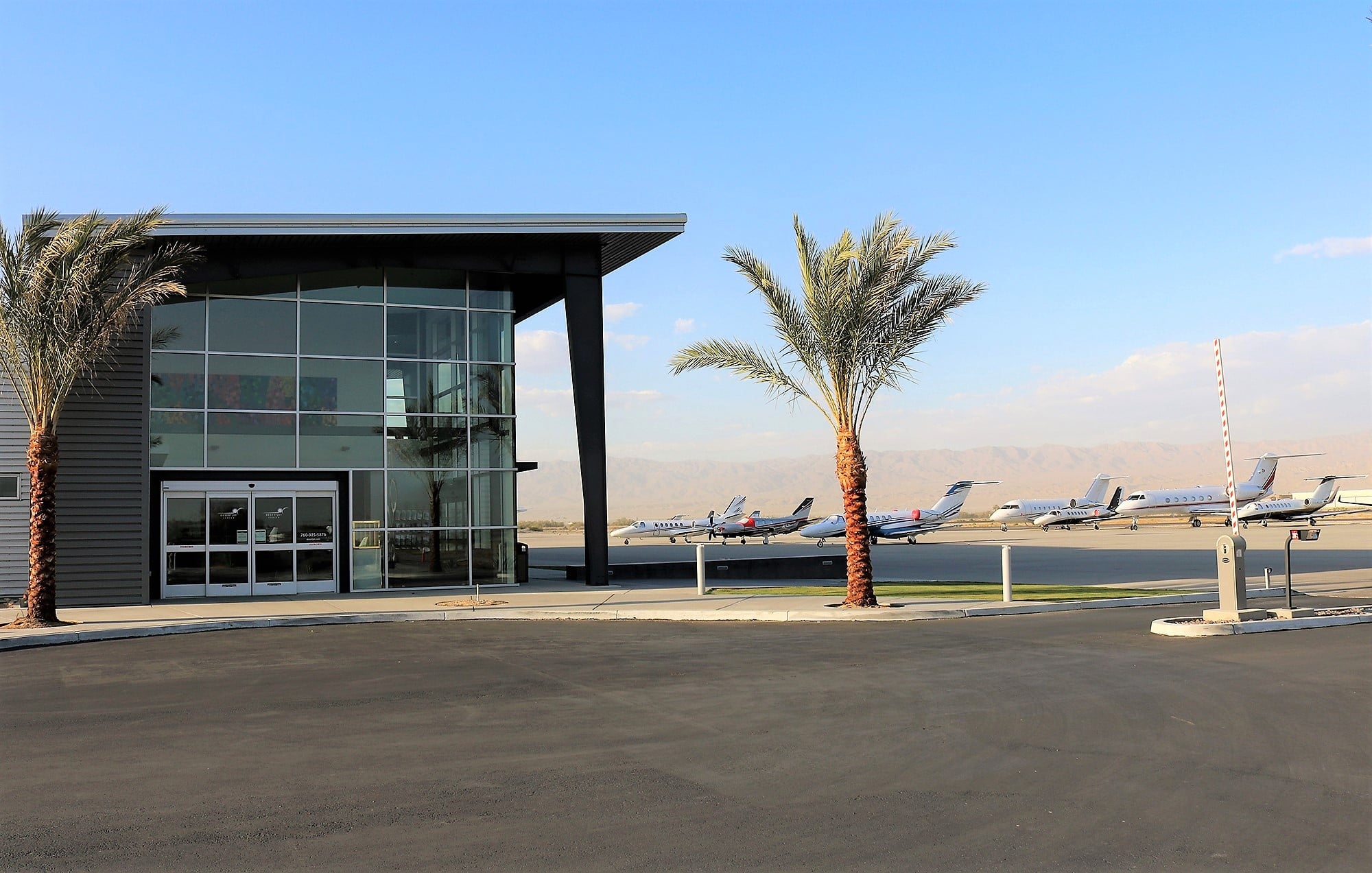 view of the Desert Jet Center and the fleet of Desert Jet aircraft in the apron